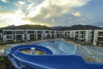 a large swimming pool in front of a building at Ciudadela Santafé De Antioquia in Santa Fe de Antioquia