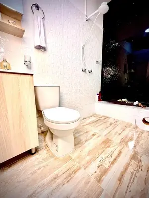 a bathroom with a toilet and a shower at AC Laureles Fast Internet for Nomads 5 Floor in Medellín