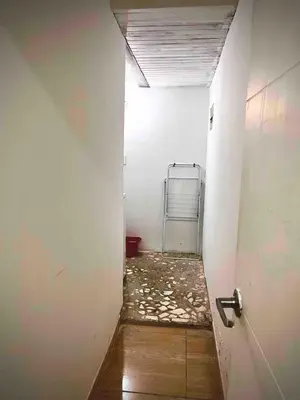 a hallway with a room with a door and a room with a unintention at AC Laureles Fast Internet for Nomads 5 Floor in Medellín