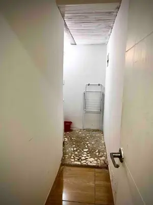 an empty hallway with a room with a door and a bed at Ac Corner, at nice 5 floor fast wifi in Medellín