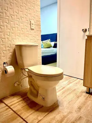 a bathroom with a toilet in a room at Ac Corner, at nice 5 floor fast wifi in Medellín