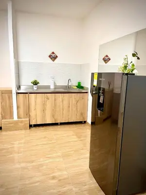 a kitchen with a sink and a refrigerator at Ac Corner, at nice 5 floor fast wifi in Medellín
