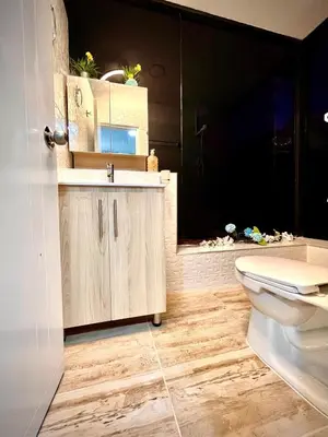 a bathroom with a sink and a toilet at Ac Corner, at nice 5 floor fast wifi in Medellín