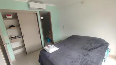 a hospital room with a bed and an open door at Apartamento cómodo y silencioso in Santa Fe de Antioquia