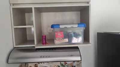 a toy refrigerator with its door open in a kitchen at Apartamento cómodo y silencioso in Santa Fe de Antioquia