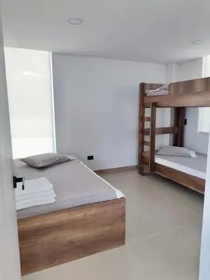 a room with two bunk beds in a room at Finca Doña Eva in Manizales