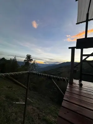 a view of the mountains from the porch of a house at Chalet Guadalupe - Girardota