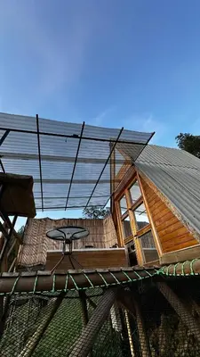 a house with a table in the middle of it at Chalet Guadalupe - Girardota