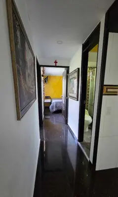 a hallway leading to a room with a bedroom at Medellin Las Palmas Beautiful View in Medellín