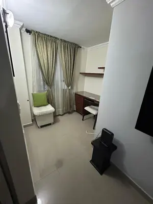 a living room with a desk and a chair at Apartment in Bello in Medellín