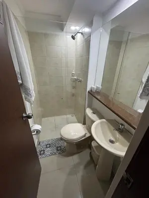 a bathroom with a toilet and a sink and a shower at Apartment in Bello in Medellín