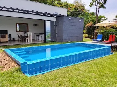 a swimming pool in the backyard of a house at Villa Antonia in Santagueda