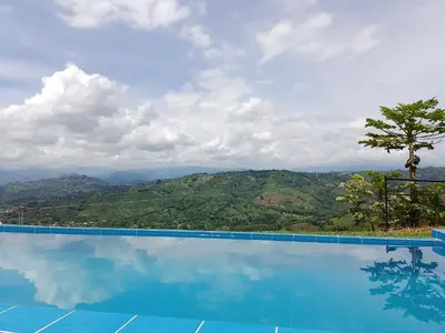 a swimming pool with a view of the mountains at Villa Antonia in Santagueda