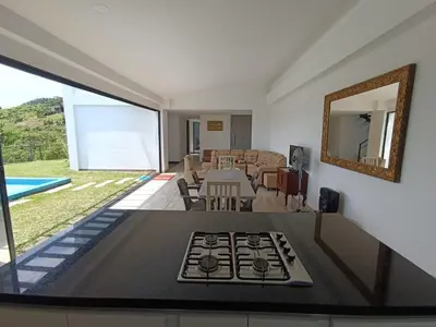 a living room with a stove in the middle of it at Villa Antonia in Santagueda
