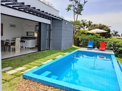 a swimming pool in the backyard of a house at Finca privada Villa Antonia