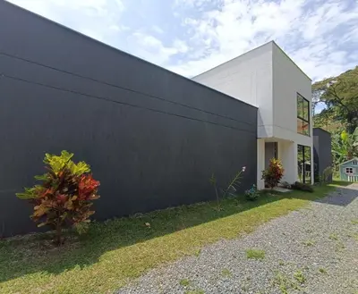 a black and white building with a black wall at Finca privada Villa Antonia