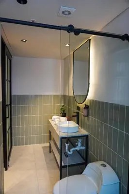 a bathroom with a sink and a mirror at Hotel Tres Altares Sabaneta in Sabaneta