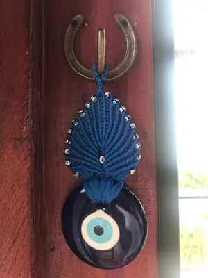 a blue object is hanging on a red door at La mejor vista del eje cafetero en el Chalet La Gitana in Marsella