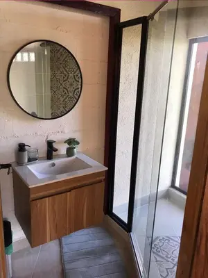 a bathroom with a sink and a mirror at La mejor vista del eje cafetero en el Chalet La Gitana in Marsella