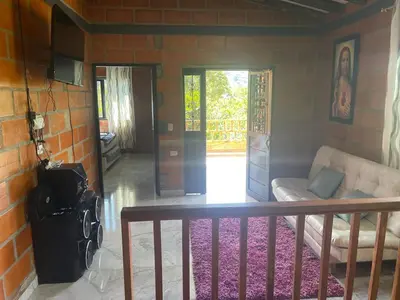 a living room with a couch and a table at Aloha Campestre in San Rafael