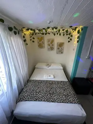a small bed in a room with a window at DESTINY Apto Parque in San Rafael
