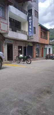 a motorcycle parked in front of a building at DESTINY Apto Parque in San Rafael