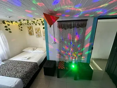 a bedroom with a bed and a ceiling with lights at DESTINY Apto Parque in San Rafael