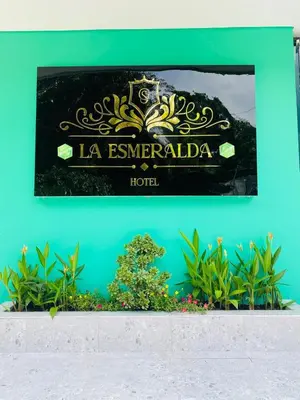 a sign for la esmeralda hotel at Hotel La Esmeralda Doradal in Doradal