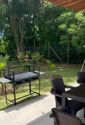 a bench sitting on a patio in a garden at La Mágica Finca en Santa Fe de Antioquia in Santa Fe de Antioquia