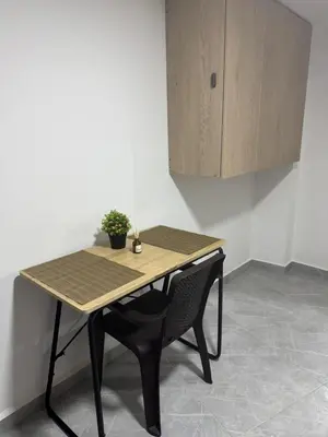 a table with a plant sitting on top of it at Villa Loreto Aparta estudio 204 in Medellín