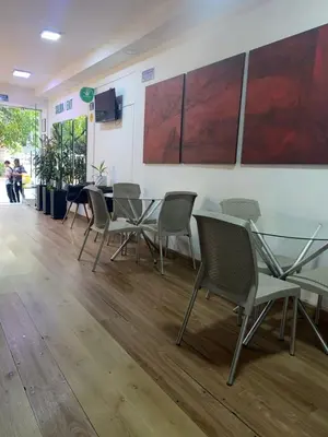 a conference room with a table and chairs at Hmetrohotel in Medellín