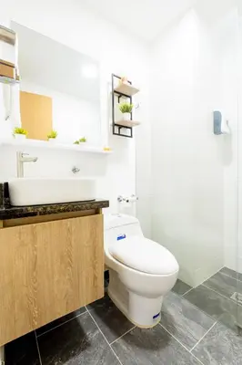 a bathroom with a white toilet and a sink at Apartamento San Jerónimo - Antioquia in San Jerónimo