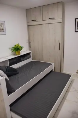 a bedroom with a bunk bed with a door at Espectacular apartamento completamente dotado en Yarumal Antioquia! in Estación El Salto