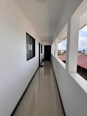 an empty hallway of a house with white walls and windows at Hermoso Apartamento Amoblado in Aguadas
