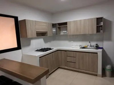a kitchen with a sink and a stove top oven at Hermoso Apartamento Amoblado in Aguadas