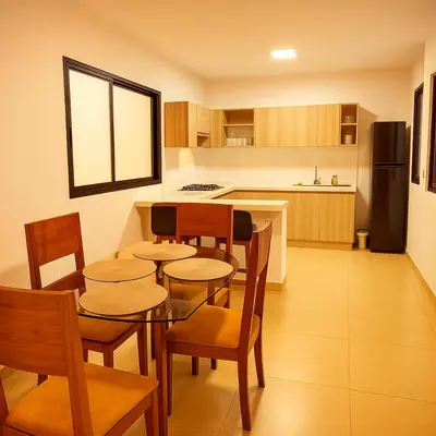 a kitchen with a table and chairs and a refrigerator at Hermoso Apartamento Amoblado in Aguadas