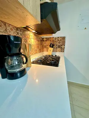 a coffee maker sitting on a counter in a kitchen at Apartamento Moderno Sabaneta Wifi 600mb in Sabaneta