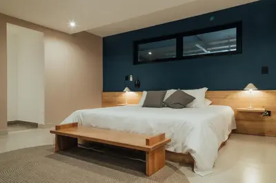 a bedroom with a large bed and a table at Edificio Boutique Alori 15-3 in Medellín