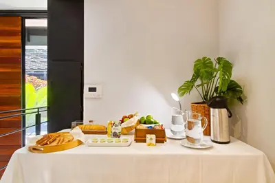 a table with bread and other food on it at Edificio Boutique Alori 15-3 in Medellín