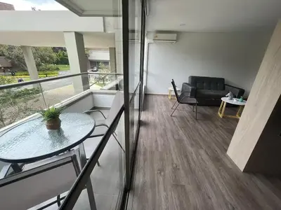 a living room with a table and a couch at Casagrande Apartahotel in Rionegro