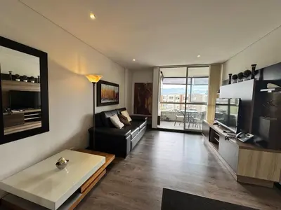 a living room with a couch and a table at Casagrande Apartahotel in Rionegro