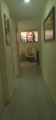 a living room with a flat screen tv on the wall at Apartamento céntrico en el poblado in Medellín