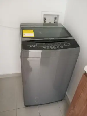 a gray stove in a corner of a room at Centro de negocios 3 33 in Medellín