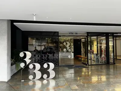 a store front with a sign in front of it at Centro de negocios 3 33 in Medellín