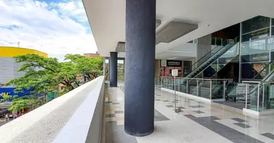 a building with a column in the middle of a street at Apartamento Loft con vista unica in Itagüí