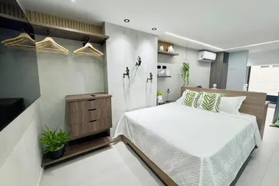 a bedroom with a bed and a television in it at 1B Luxury Apartment San Javier medellin in Medellín