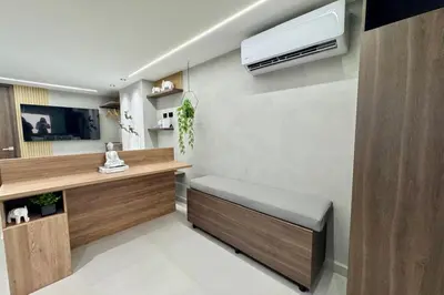a room with a desk with a bench and a heater at 1B Luxury Apartment San Javier medellin in Medellín