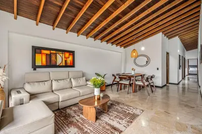 a living room with a couch and a table at Urban 5th floor Living with AC unit 3Bed3bth no elevator 5 guests max in Envigado