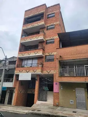a red brick building with balconies on it at Urban 5th floor Living with AC unit 3Bed3bth no elevator 5 guests max in Envigado