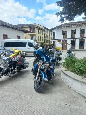 a row of motorcycles parked in a parking lot at Alojamiento Betina in Salamina